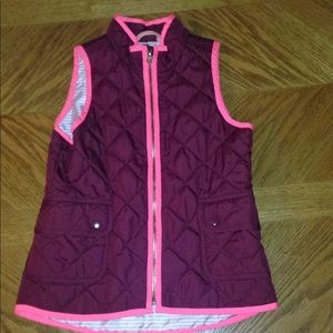 Pink and maroon vests
